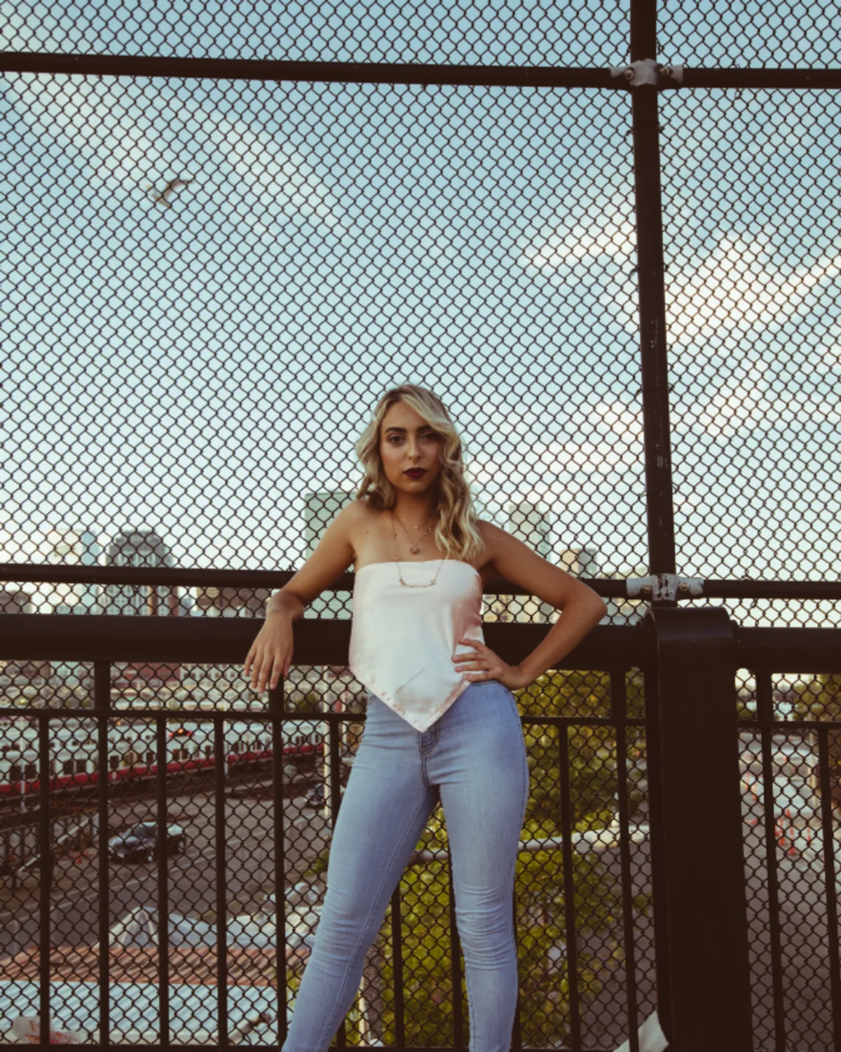 Woman styling a fitted bodysuit with jeans