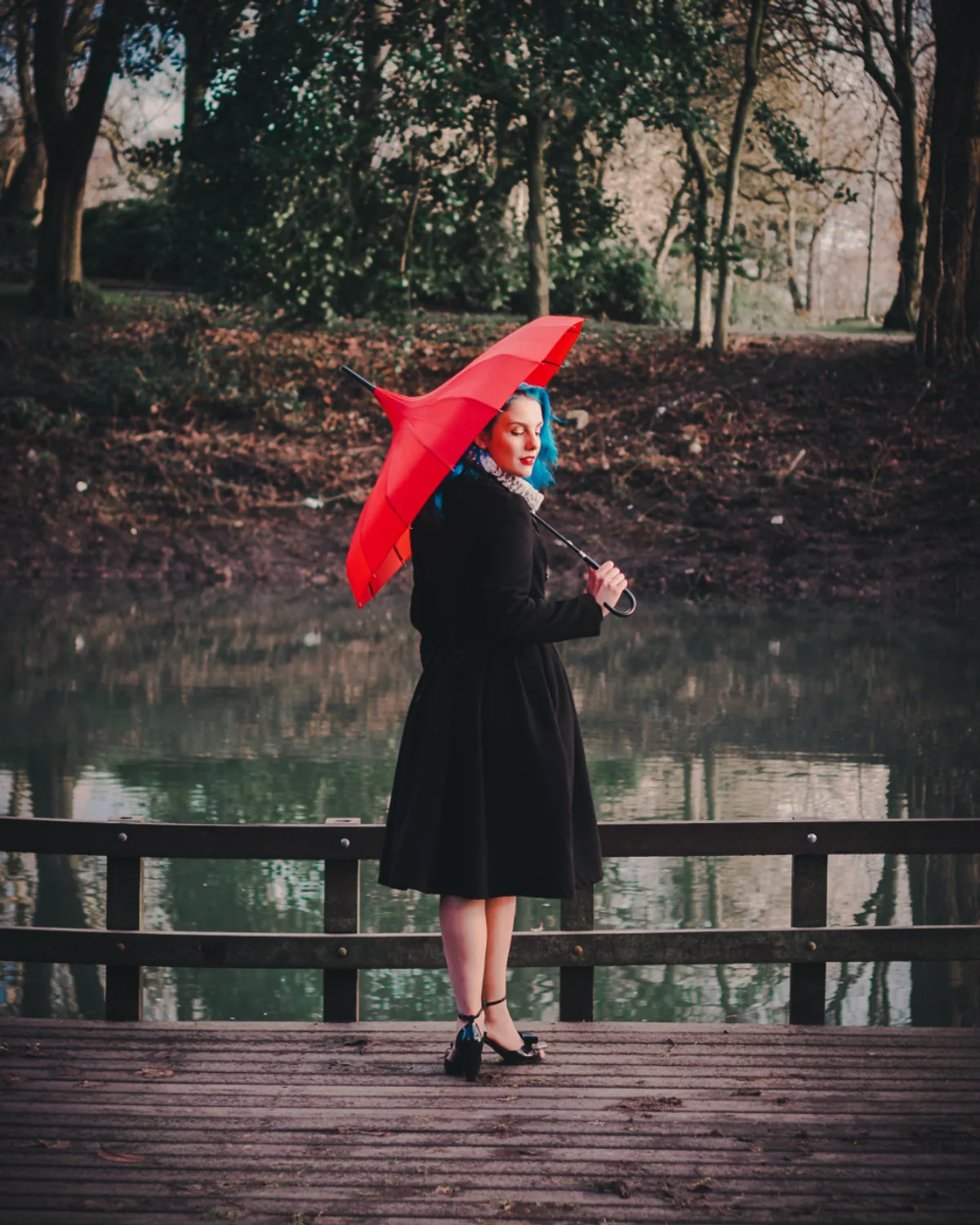 Woman styling a black dress for an evening event