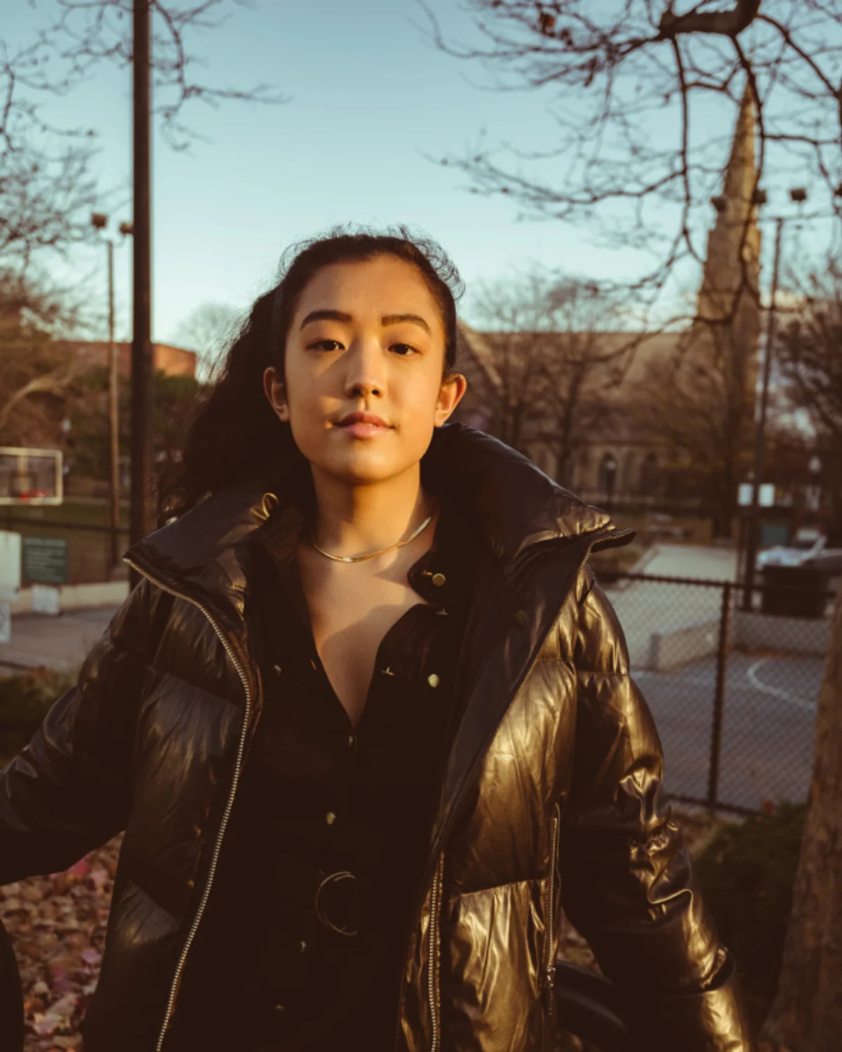 Woman styling a leather jacket